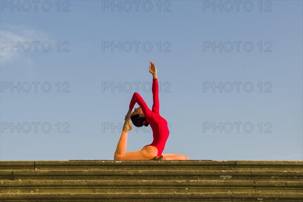 Young woman practising Hatha yoga