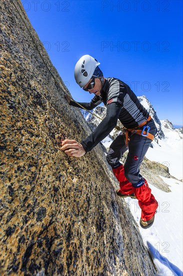 Climber climbing on a rock wall