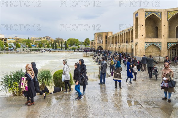 Many people at Khaju bridge over Zayande-Rud river