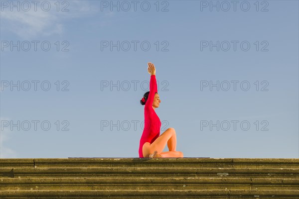 Young woman practising Hatha yoga