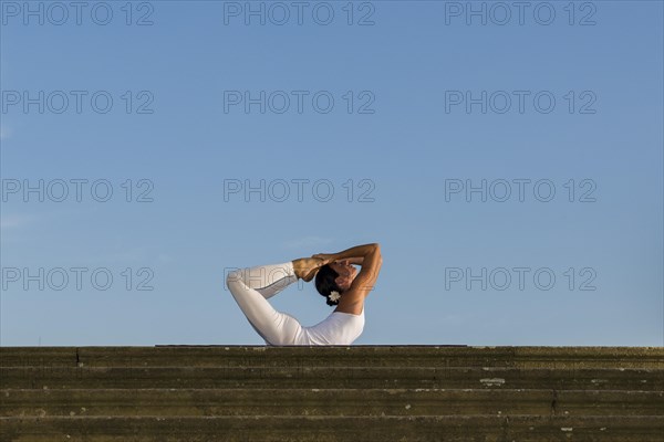 Young woman practising Hatha yoga