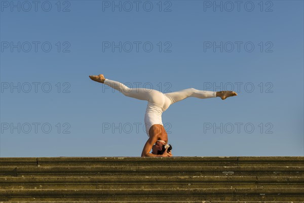 Young woman practising Hatha yoga