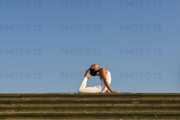 Young woman practising Hatha yoga