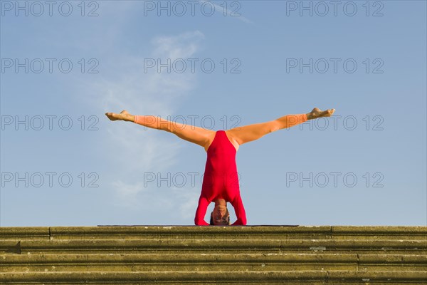 Young woman practising Hatha yoga