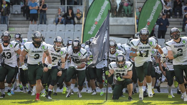 The team of the Danube Dragons runs on the field before an Austrian Football League game