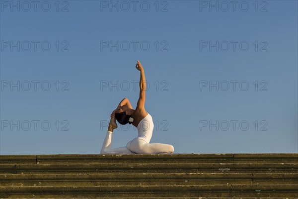 Young woman practising Hatha yoga