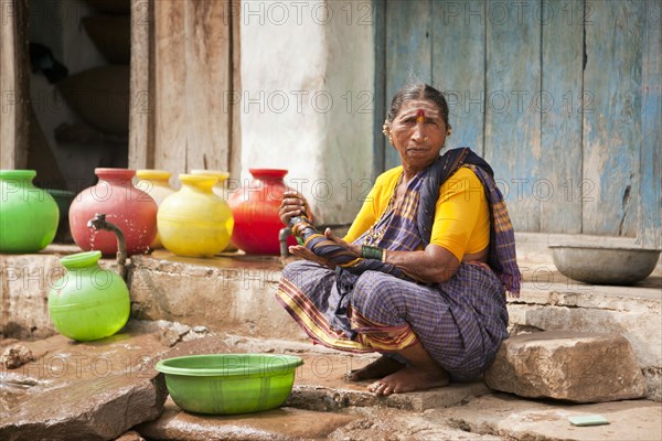 Elderly woman washing her hands