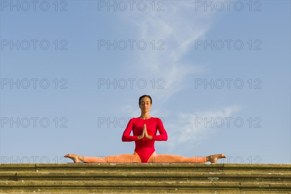 Young woman practising Hatha yoga