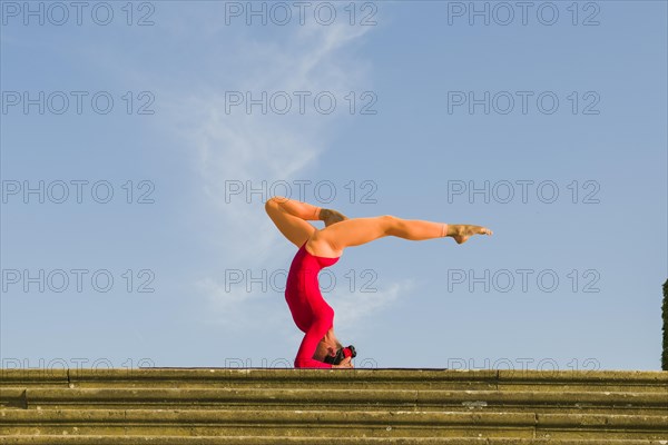 Young woman practising Hatha yoga