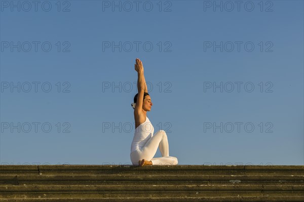 Young woman practising Hatha yoga