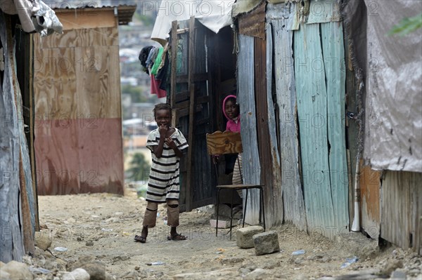 Children in front of a shack