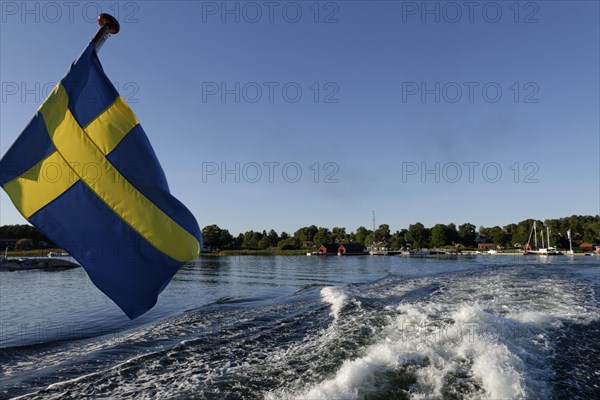 Ship with Swedish flag off Husaro