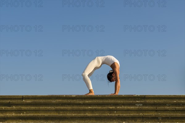 Young woman practising Hatha yoga