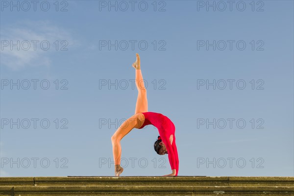 Young woman practising Hatha yoga