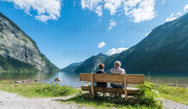 Two people sitting on a bench