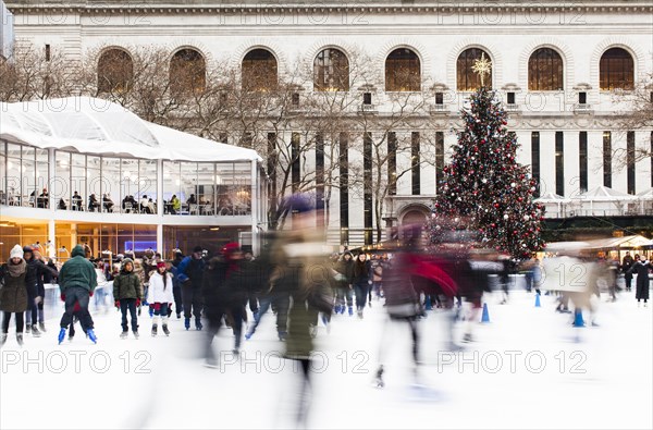 Skating in Bryant Park with the Public Library at the back