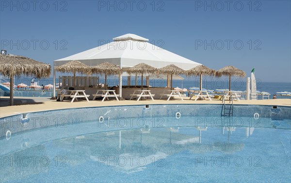 Swimming pool and cafe on the beach in Golden Sands resort