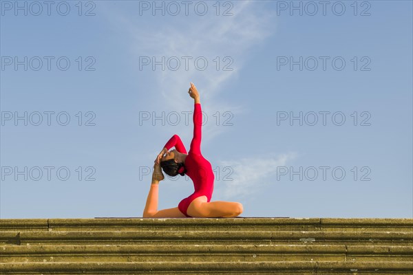 Young woman practising Hatha yoga