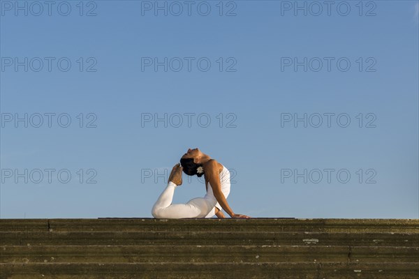 Young woman practising Hatha yoga