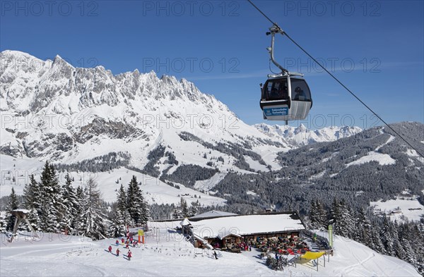 Karbachalm ropeway in front of mountain scenery