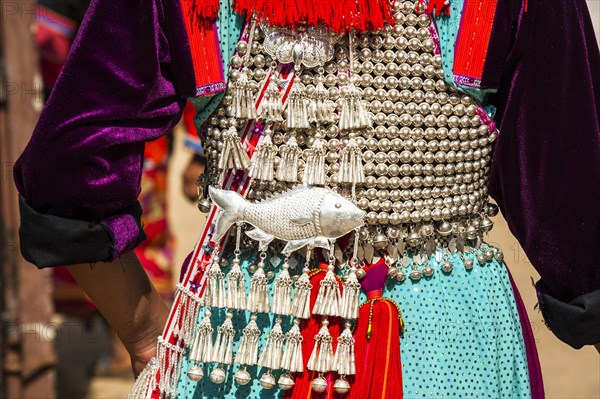 Traditionally decorated dress a woman from the Lisu people