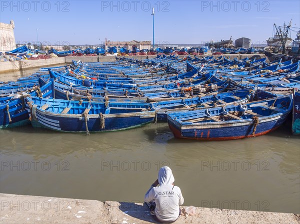 Old blue fishing boats in the port of Essaouira