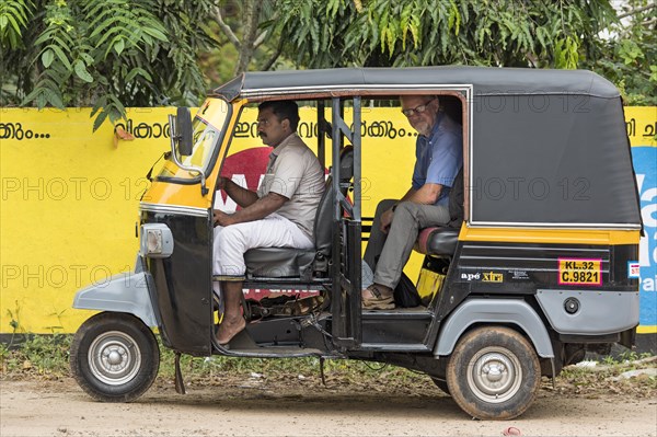 Tourist in motor rickshaw