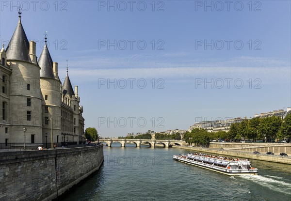 Conciergerie and a cruise ship on the Seine