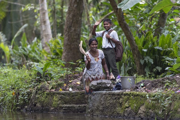 Woman and child waving