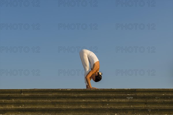 Young woman practising Hatha yoga