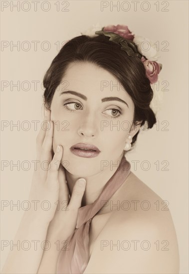 Beauty portrait of a young woman with flowers in her hair