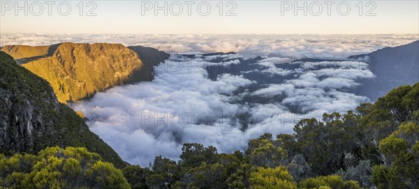 Sunset above sea of clouds at Cilaos basin