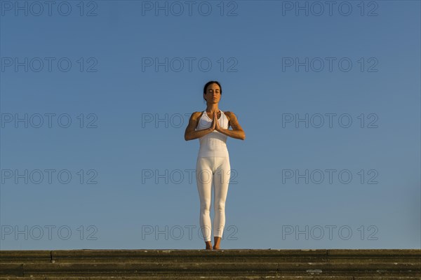 Young woman practising Hatha yoga