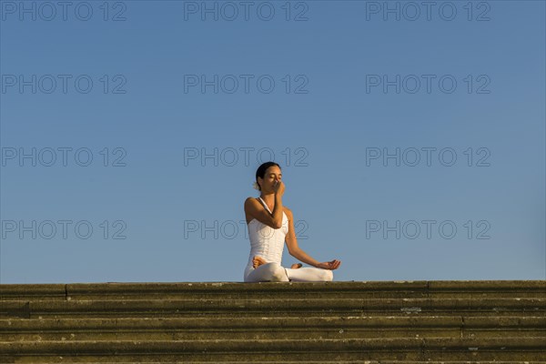 Young woman practising Hatha yoga