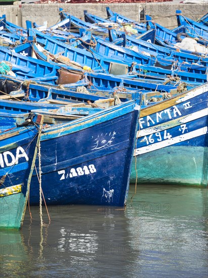 Old blue fishing boats in the port of Essaouira