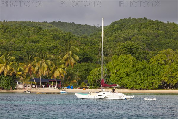 Beach with sailing boat