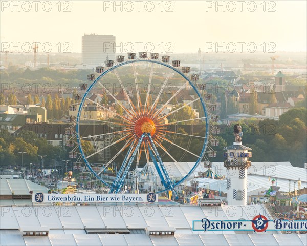 Ferris wheel with Lowenbrau tower