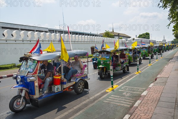 Tuktuk taxi convoy in the street