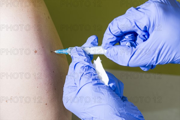 Injection of medicine into an arm