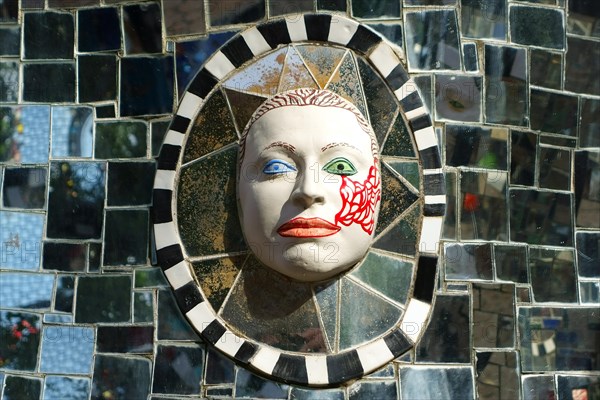 Face in relief in the Giardino dei Tarocchi or Garden of the Tarot