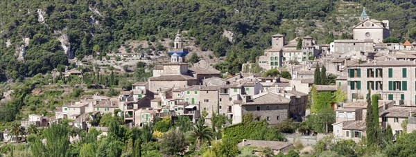 Valldemossa with the Carthusian Valldemossa Charterhouse and the parish church of Sant Bartomeu