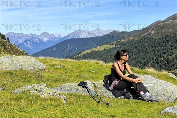 Woman resting after a mountain hike