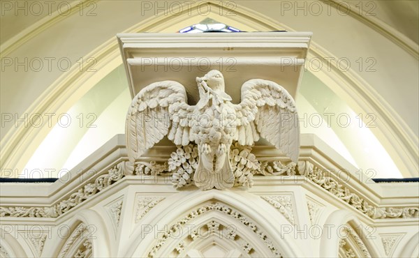 Dove figure on the altar in the interior of the ""First Church of Otago