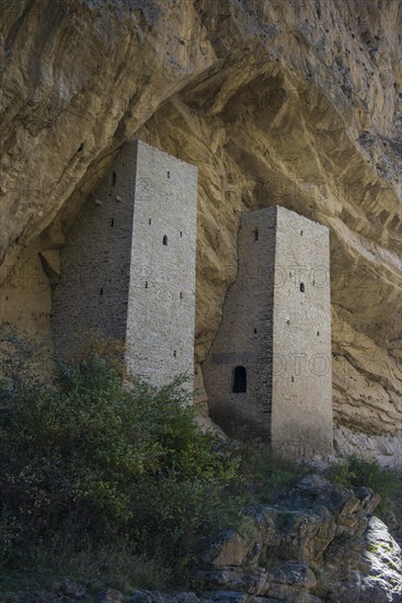 Chechen watchtowers under overhanging cliff on the Argun river