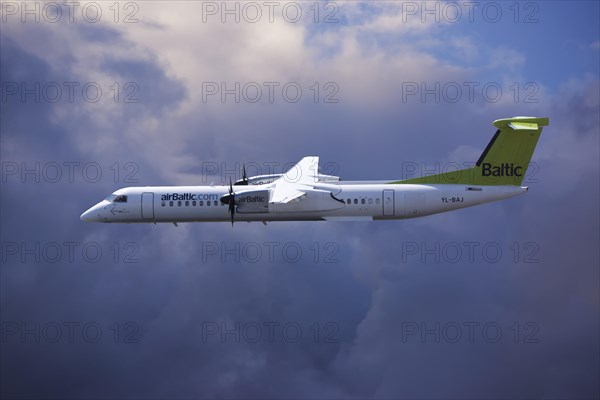 Aircraft YL-BAJ Air Baltic De Havilland Dash 8 flying in bad weather