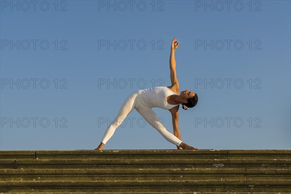 Young woman practising Hatha yoga