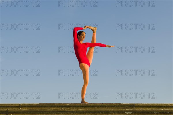 Young woman practising Hatha yoga