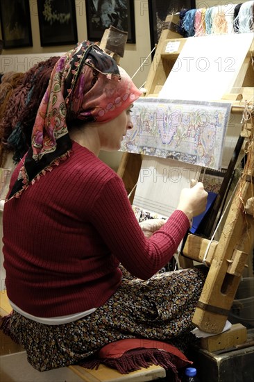 Woman working in a carpet factory