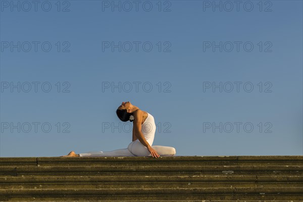 Young woman practising Hatha yoga