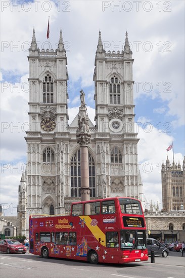 Red double-decker bus in front of Westminster Abbey